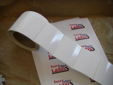 Glossy white adhesive labels in sheets or rolls